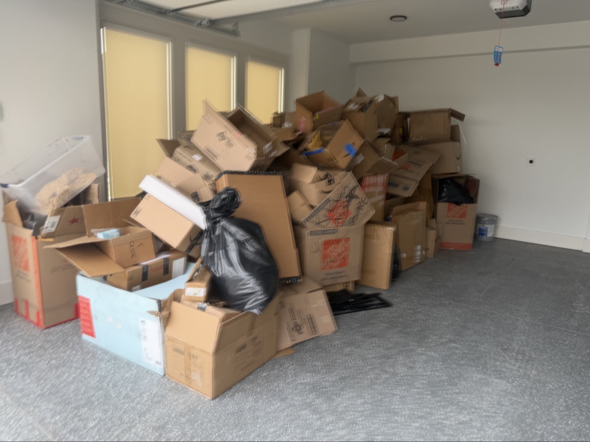 Garage packed with cardboard boxes before the cleanout